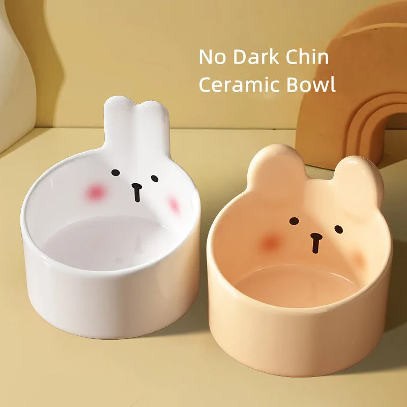 Blush Critter ceramic pet food bowl in white rabbit design, showing raised neck protection ring.