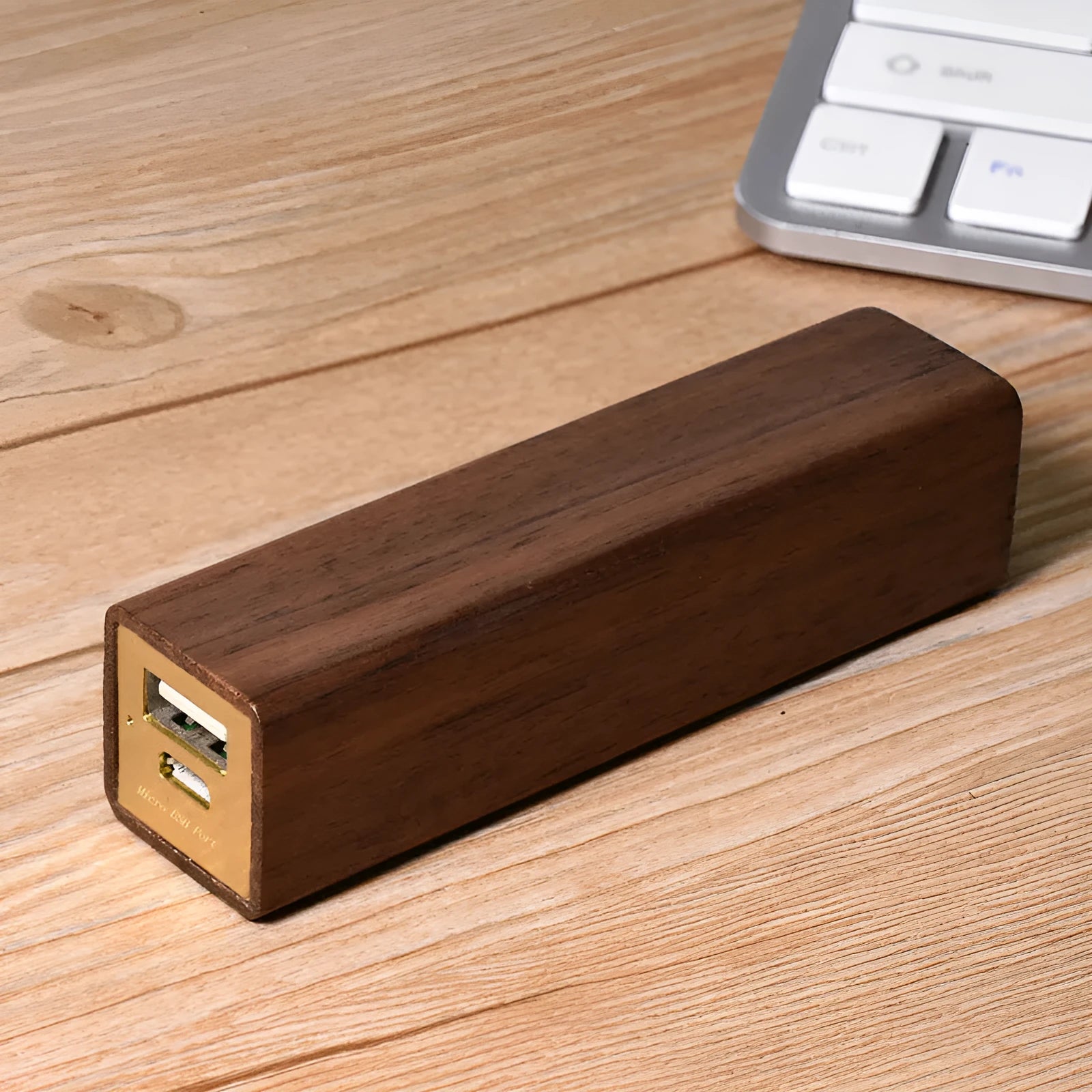 Black walnut wood portable power bank showing wooden casing with USB port and dimensions of 100mm x 25mm x 25mm
