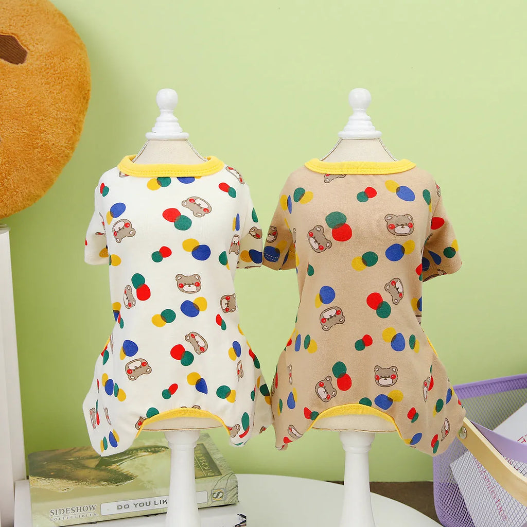 Beige dog costume with colourful ball bear design, made from cotton and spandex blend.