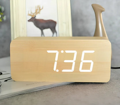 Rectangular wooden alarm clock 21cm long with LED display showing time, date, temperature rotation and voice control buttons