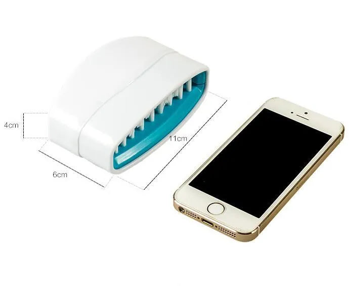 Blue kitchen cleaning brush with suction cup base for washing fruit, vegetables and cutlery.