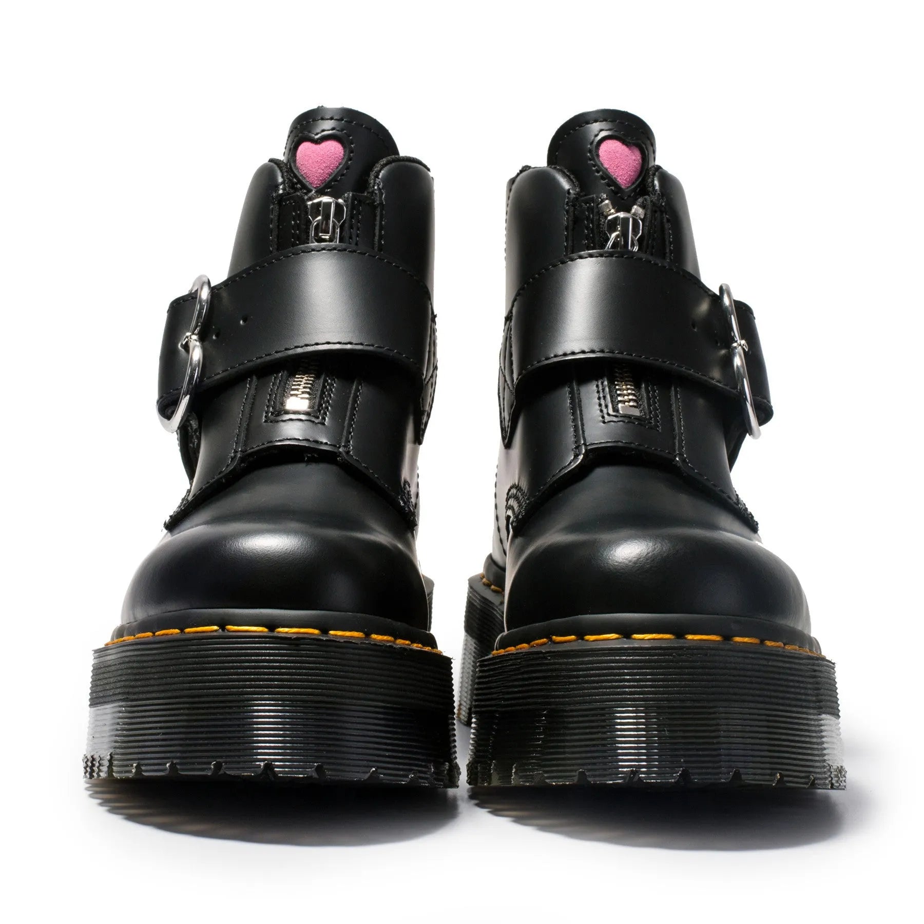 Women's black leather ankle boots with chunky heel, lace-up front, side zip, and belt buckle detail on a waterproof platform