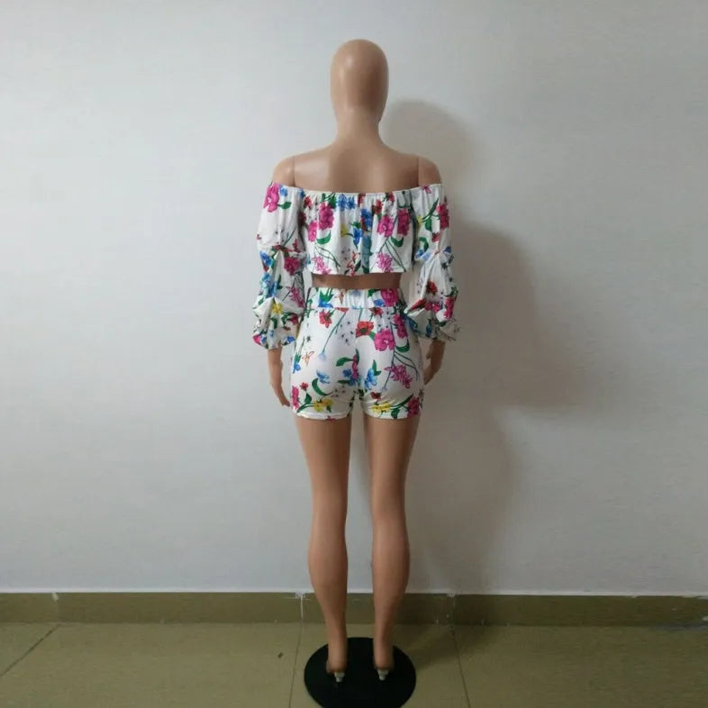 Women's multicolour digital print two-piece playsuit with fluffy pile sleeves and matching shorts.