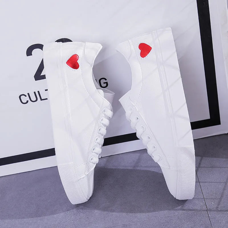 Women's PU leather heart pattern flat shoes in white red colour with non-slip rubber sole