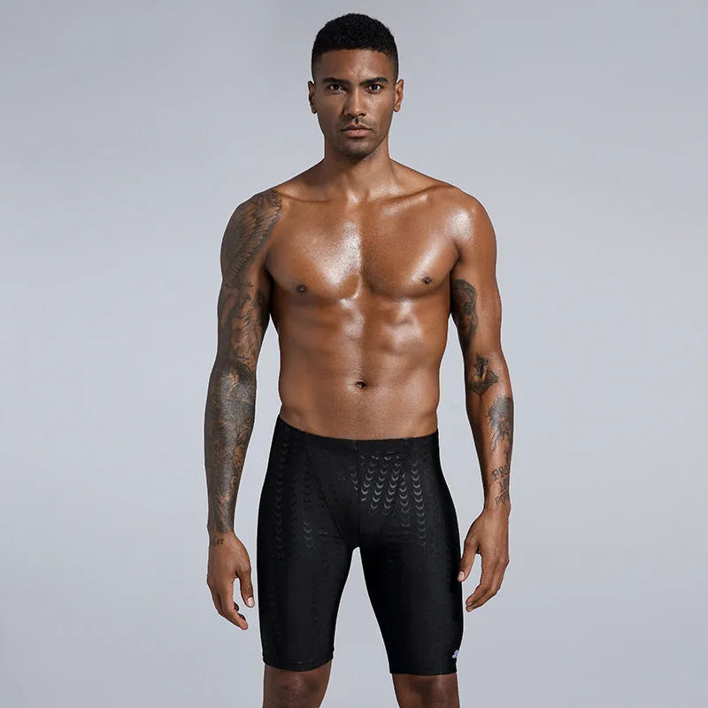 Men's solid colour polyester swimming trunks for surfing and beach use in sizes XL to 4XL
