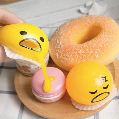 Gudetama Vomiting Egg Toy in green, orange, pink, and yellow