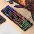 TX35 mechanical feeling keyboard in white and black rainbow colour options next to a laptop.