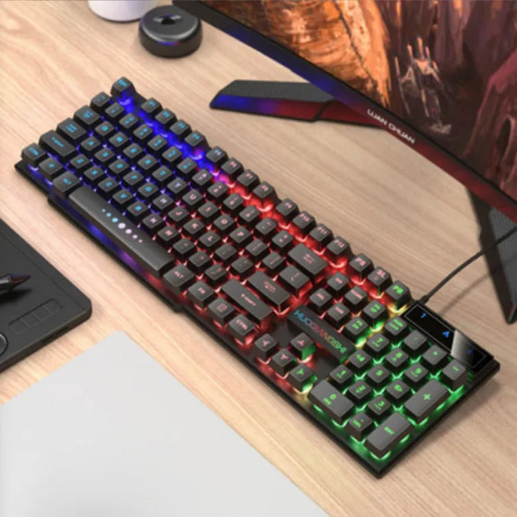 TX35 mechanical feeling keyboard in white and black rainbow colour options next to a laptop.