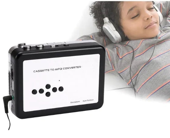 White USB Cassette to MP3 Converter with earphone and USB cable on desk