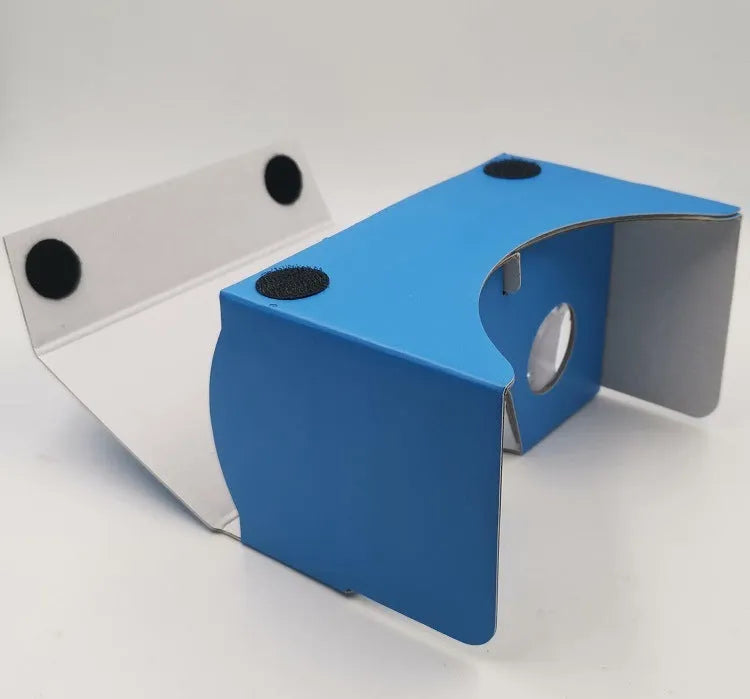 Pink and white foldable VR cardboard glasses headset with 3D lenses for smartphones.
