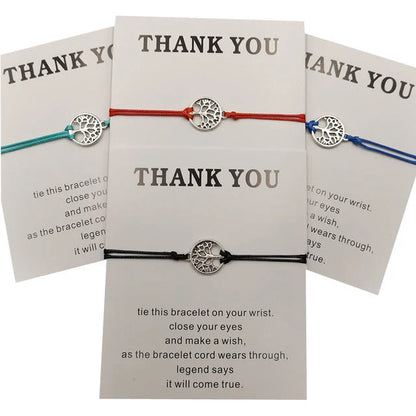 Hand-woven red rope Tree of Life bracelet with adjustable sizing