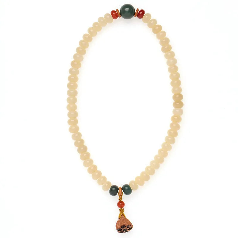 Wooden Bodhi root bracelet with flat round 6x9mm beads in milk butter colour