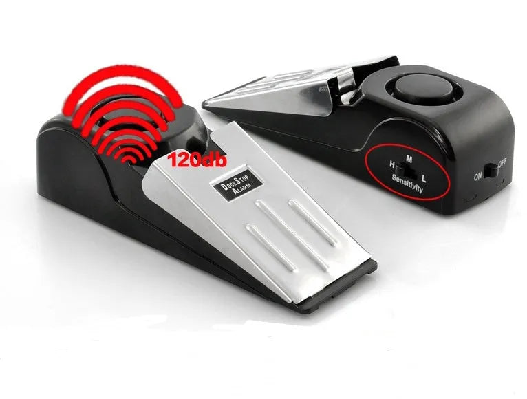 Black wedge-shaped door alarm with stainless steel cover and sensitivity controls