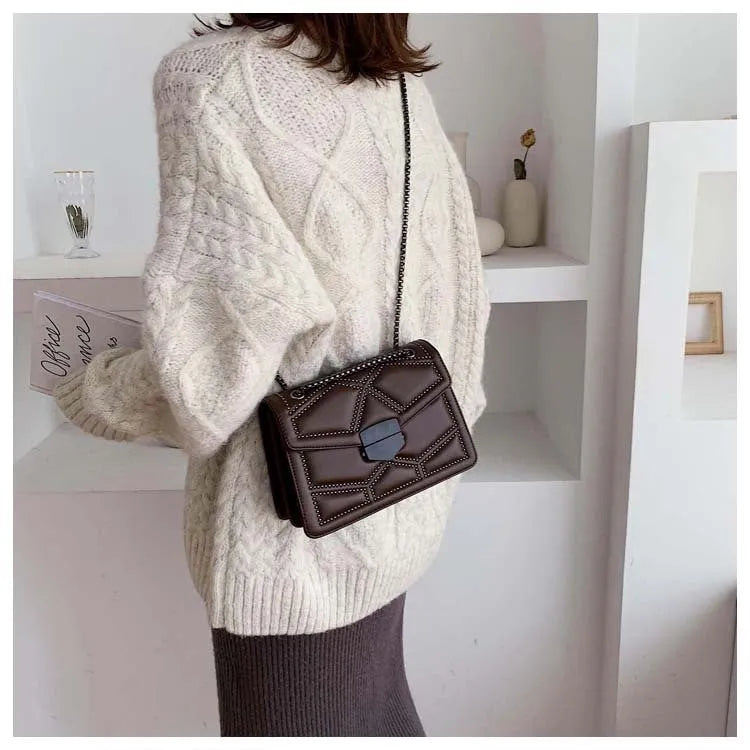 Small square shoulder bag with studs, chain handle, black colour, flat lay view