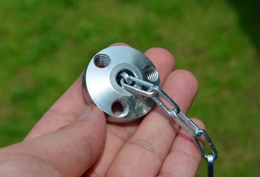 Silver aluminium camping tripod with hanging chain for outdoor barbecue cooking