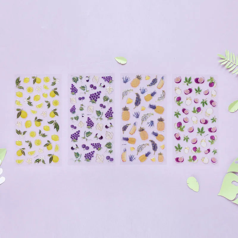 Roll of DIY fruit bronzing stickers showing grape, orange, passion fruit, peach, pineapple, and strawberry designs