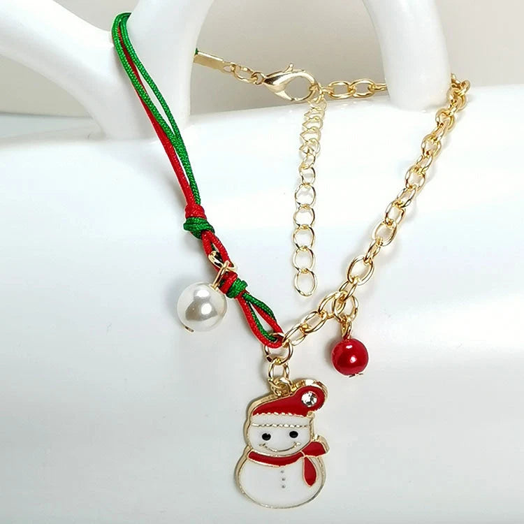 Christmas charm bracelet with snowman, Santa Claus, and snowflake designs