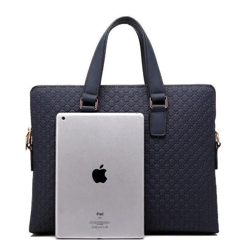 Genuine leather men's business handbag in blue with embossed geometric pattern, soft handles, and zipper closure, designed for a 14-inch laptop