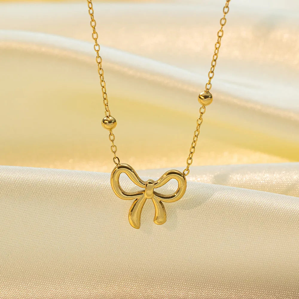 Gold bow necklace with titanium steel cross chain, adjustable length 41-50cm