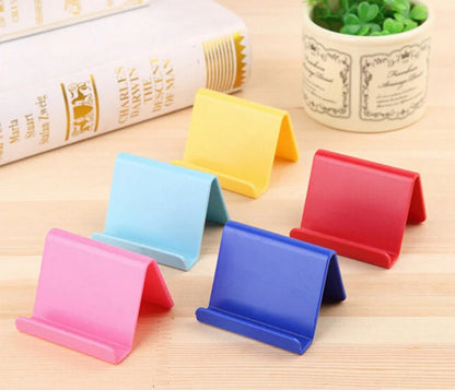 Candy colour plastic phone holder showing 6cm width and 4.5cm height dimensions
