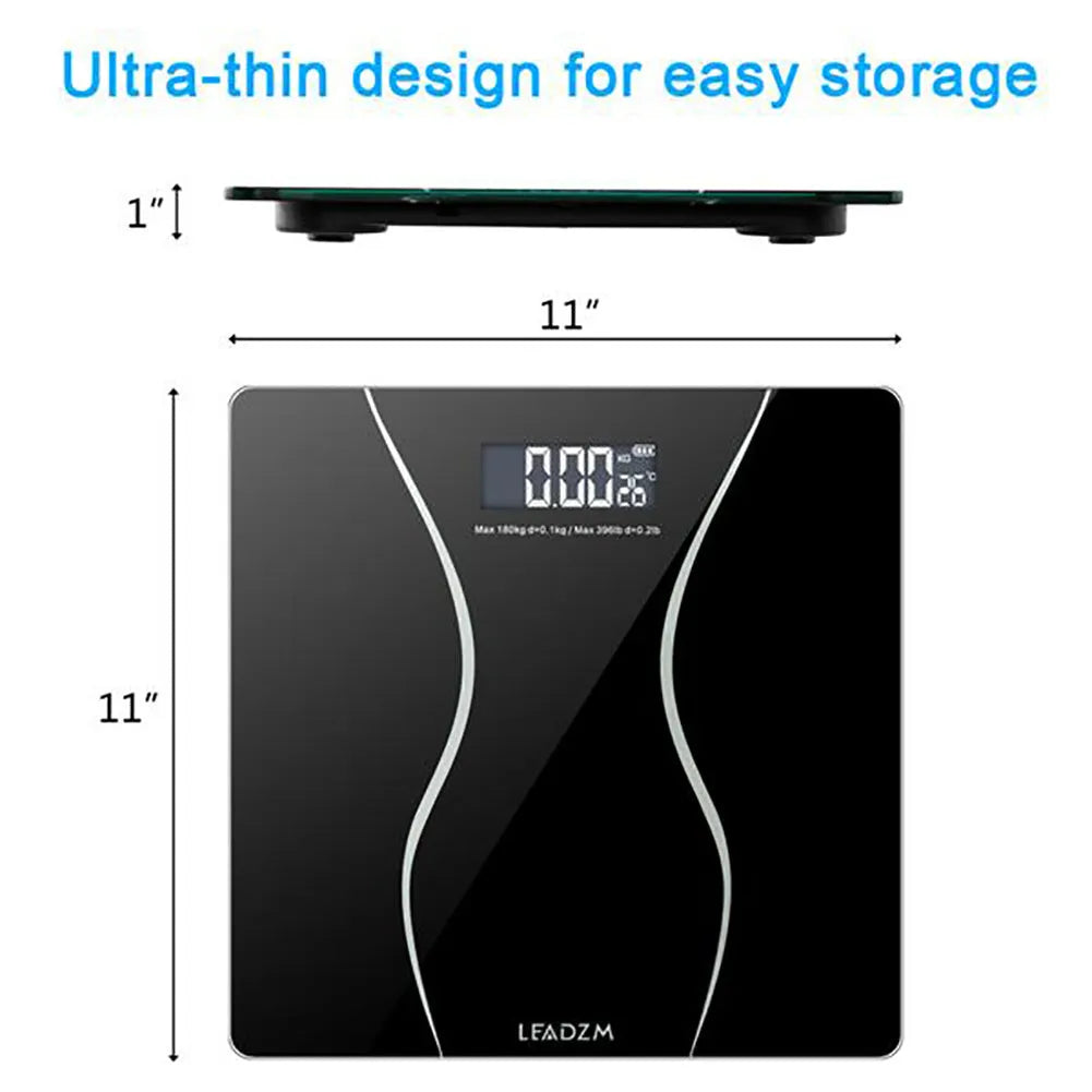 Black electronic body scale on a floor, showing digital display.