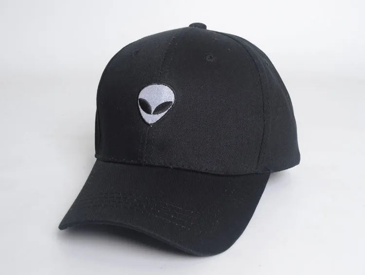 Alien head embroidered baseball cap in black with green label, cotton satin weave, side view