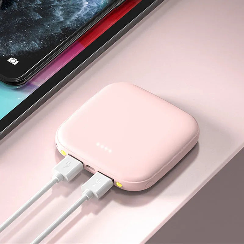 Portable 10000mAh power bank with multi-USB ports in black, white, blue, and pink colours
