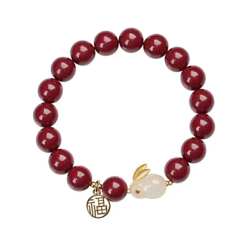 Purple gold sand cinnabar bracelet with jade hare charm in retro style.