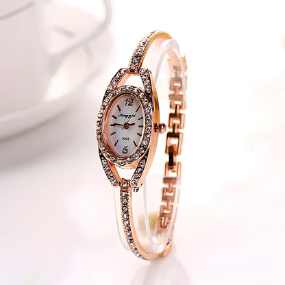 Silver-toned women's quartz bracelet watch with 25mm round dial, 185mm strap, and slim 7mm case for everyday wear