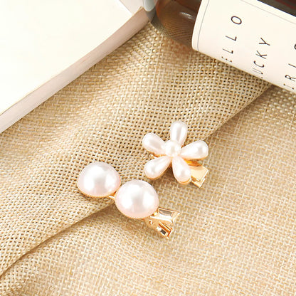 Slip-on pearl bow hair clip in alloy with flower at 2.4cm and pearls up to 7.2cm, secure grip design