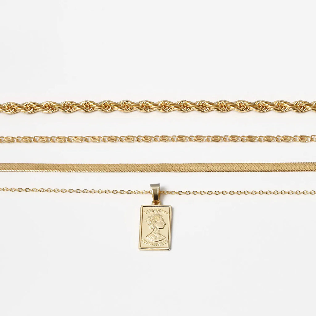 Golden geometric alloy electroplated anklet on white background