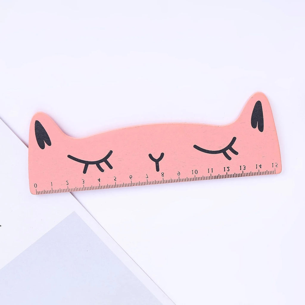Creative cat-shaped wooden ruler measuring 13 cm in pink colour on white background