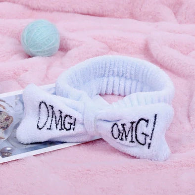 Coral velvet butterfly end hair band in pink with text styling, showing butterfly ends and cloth material