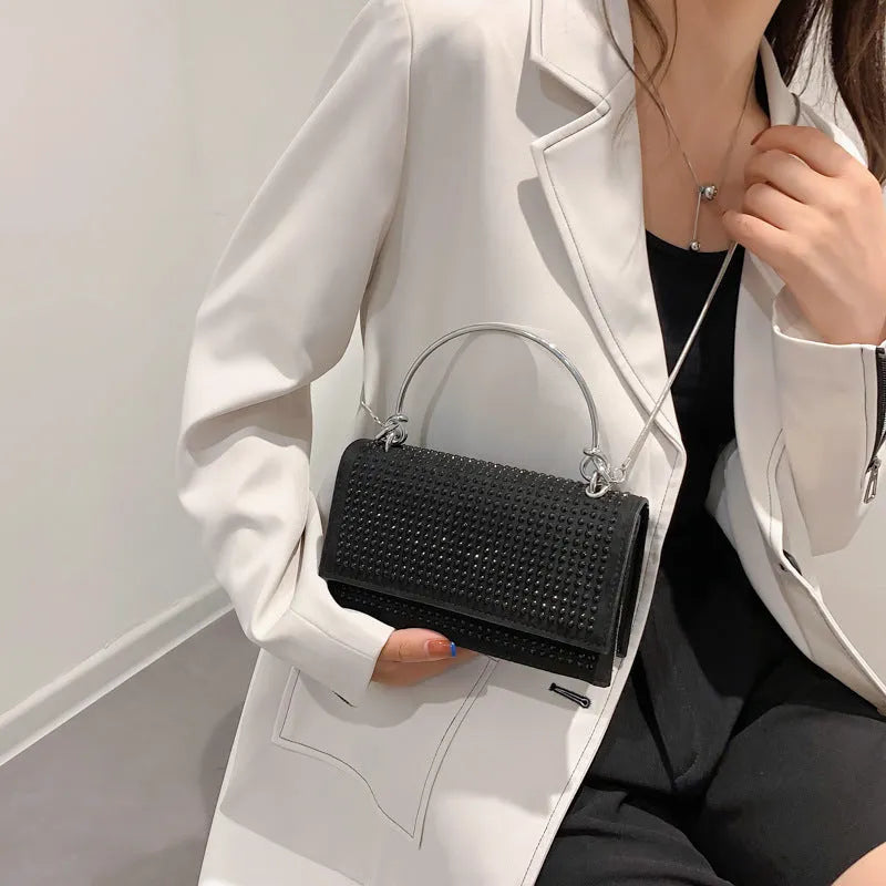 Small square chain crossbody bag for women with rhinestones in silver and black, PU construction with crossbody strap