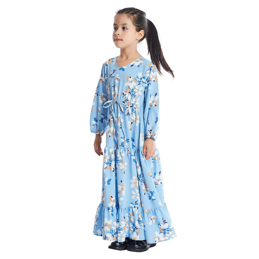 Girl wearing a long sleeve floral polyester dress with a flounced skirt in beige, available in heights 100-160cm