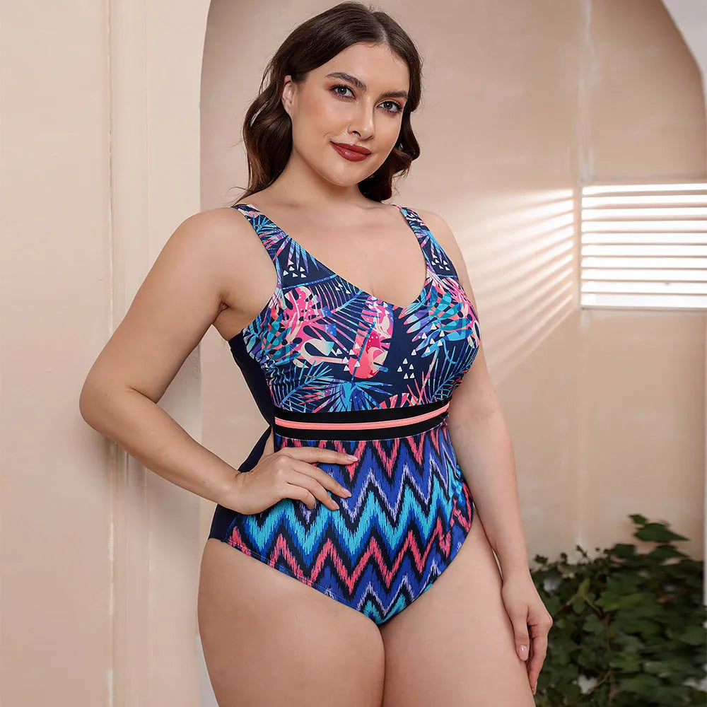 Women's blue printed one-piece swimsuit with spaghetti straps and a striped vest design laid flat.