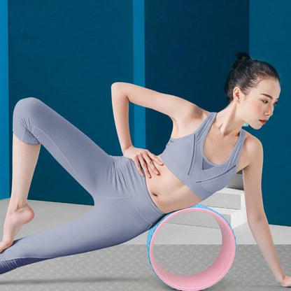 Yoga wheel with 31.5cm diameter in blue colour showing EVA outer ring and ABS inner construction