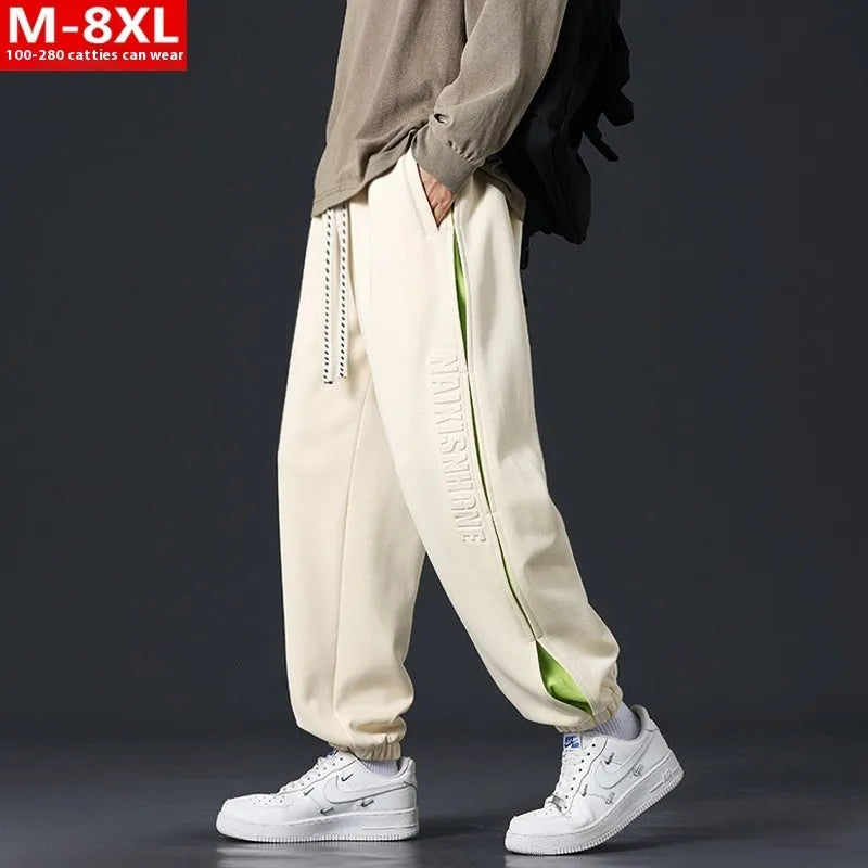 Men's grey green loose fit jogger pants with elasticated ankle bands and waist.
