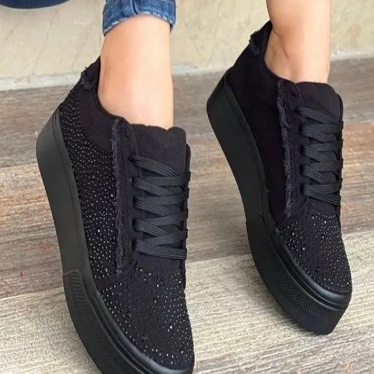 Plus size women's black lace-up casual pumps with rhinestones on a chunky flat rubber sole.