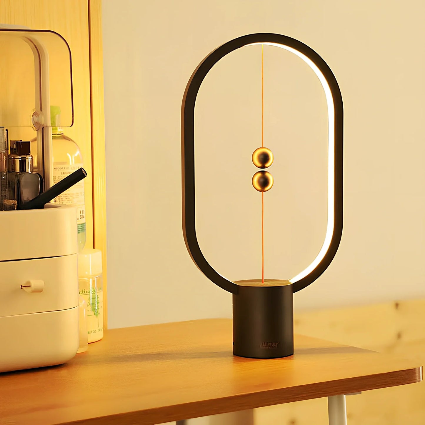 Magnetic bedside night light with ball activation system and adjustable brightness settings