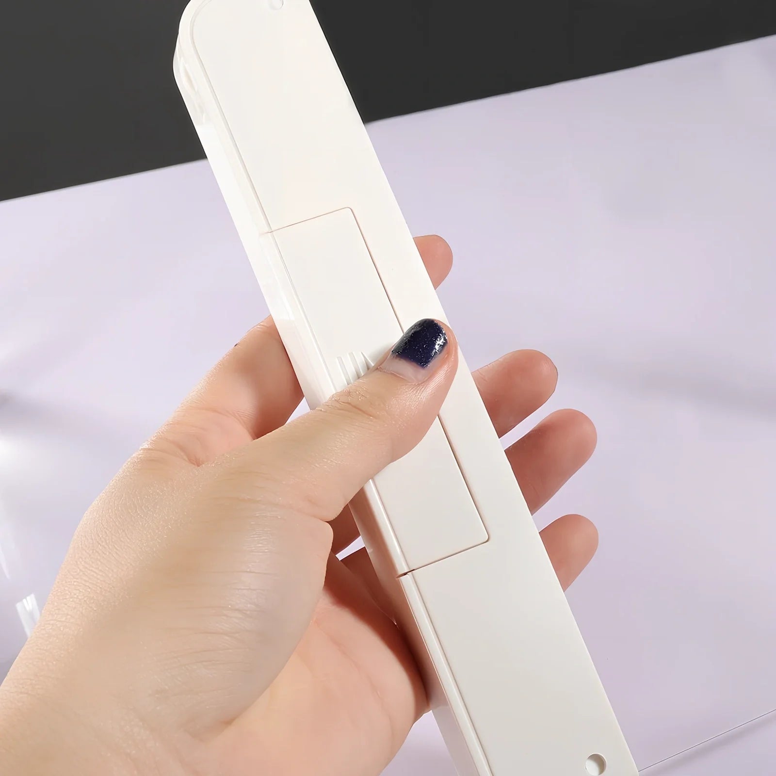 Compact dimmable LED book lamp in black with 17.6x17.8 cm panel for eye-safe night reading