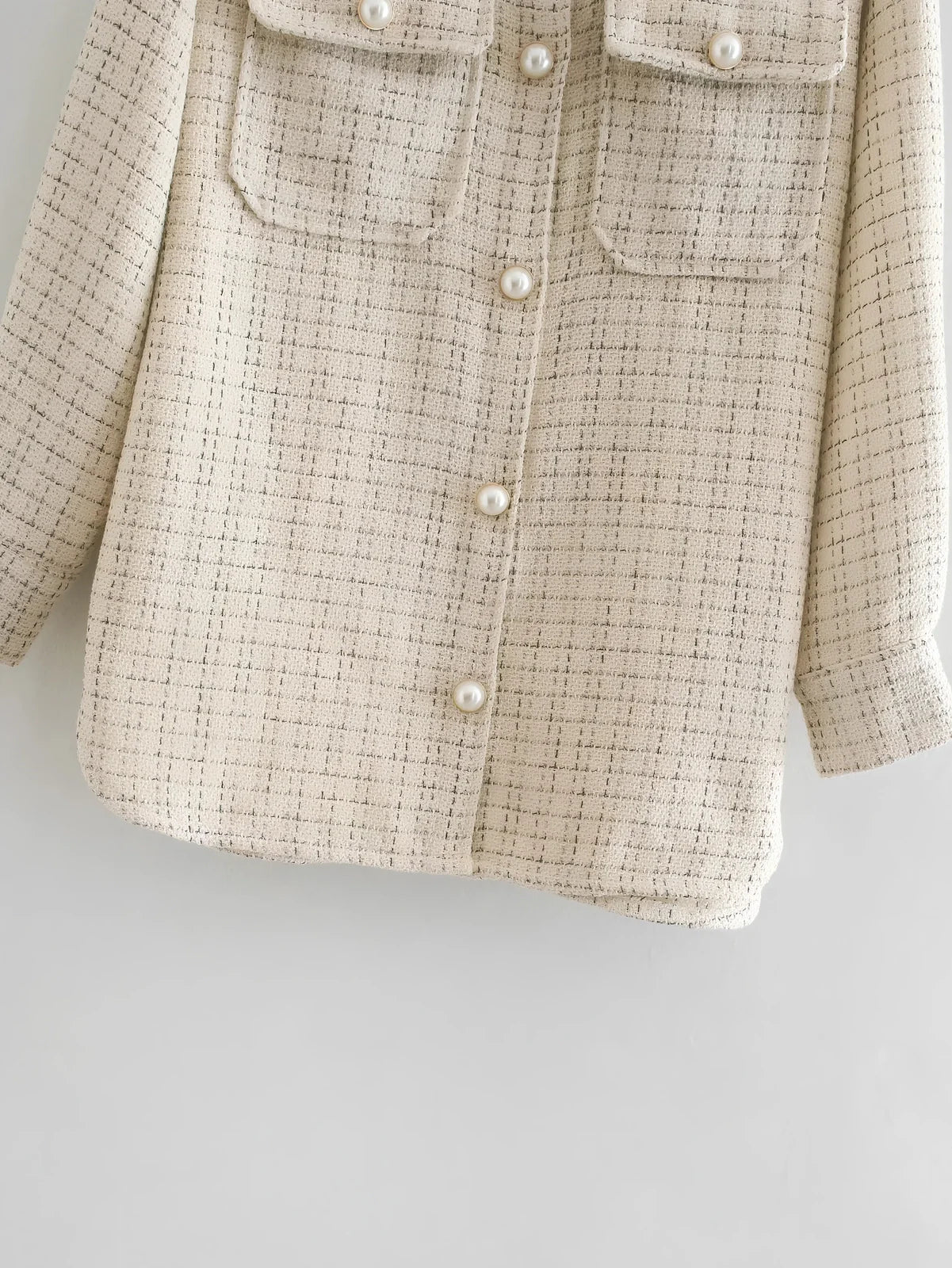 Women's beige plaid thick coat with pearl buttons, long sleeves, lapel collar, and side pockets in size M