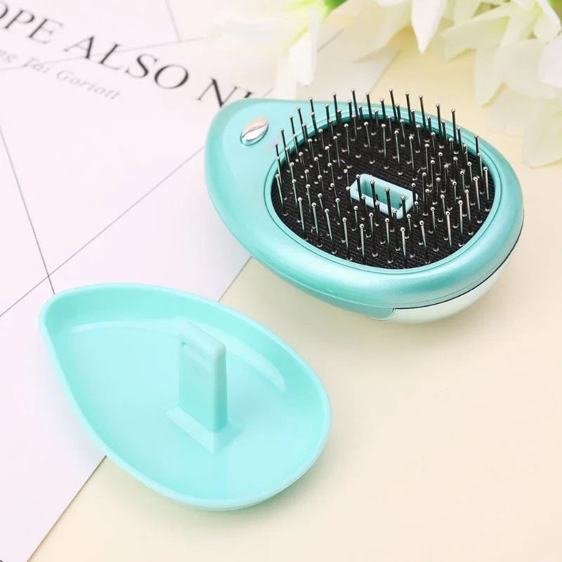 Portable negative ion hair comb with sound wave vibration technology in pink and green