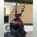 Black crown ornament with a long feather for decorating a motorcycle helmet.