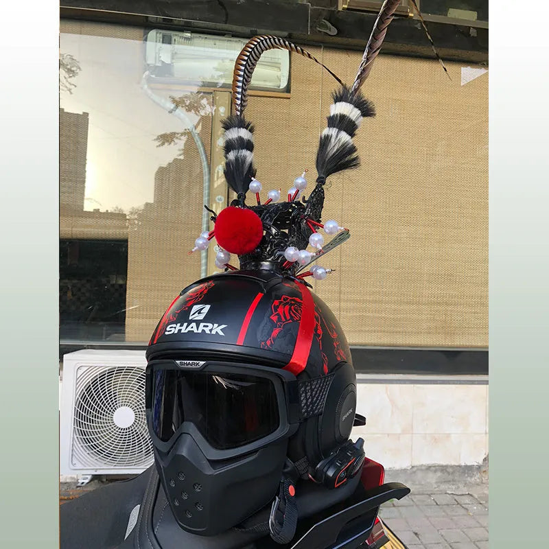 Black crown ornament with a long feather for decorating a motorcycle helmet.