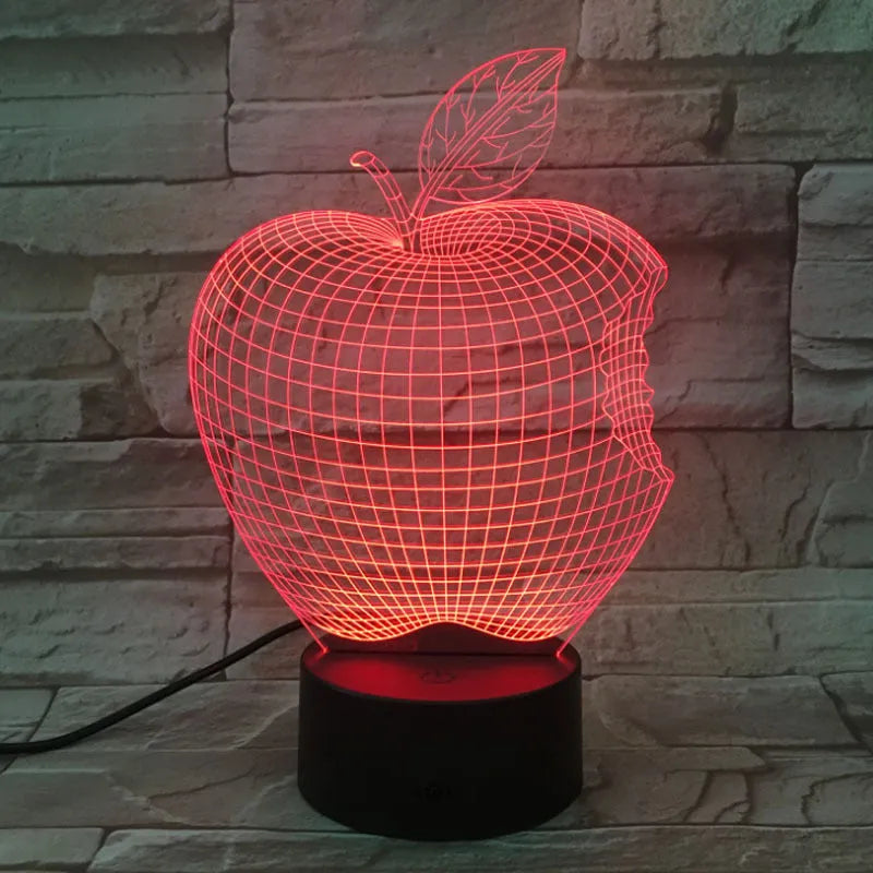 3D fruit-shaped colourful LED night light with touch control on a surface.