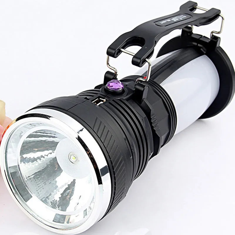 Black solar-powered LED emergency torch with USB charging port