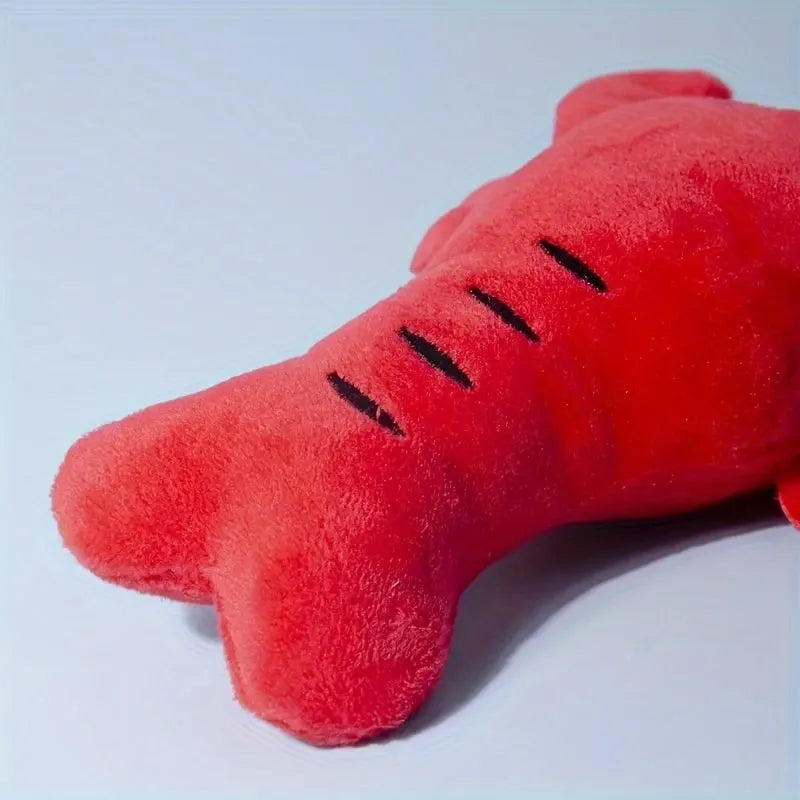 Red lobster stuffed dog toy with flapping tentacles on white background