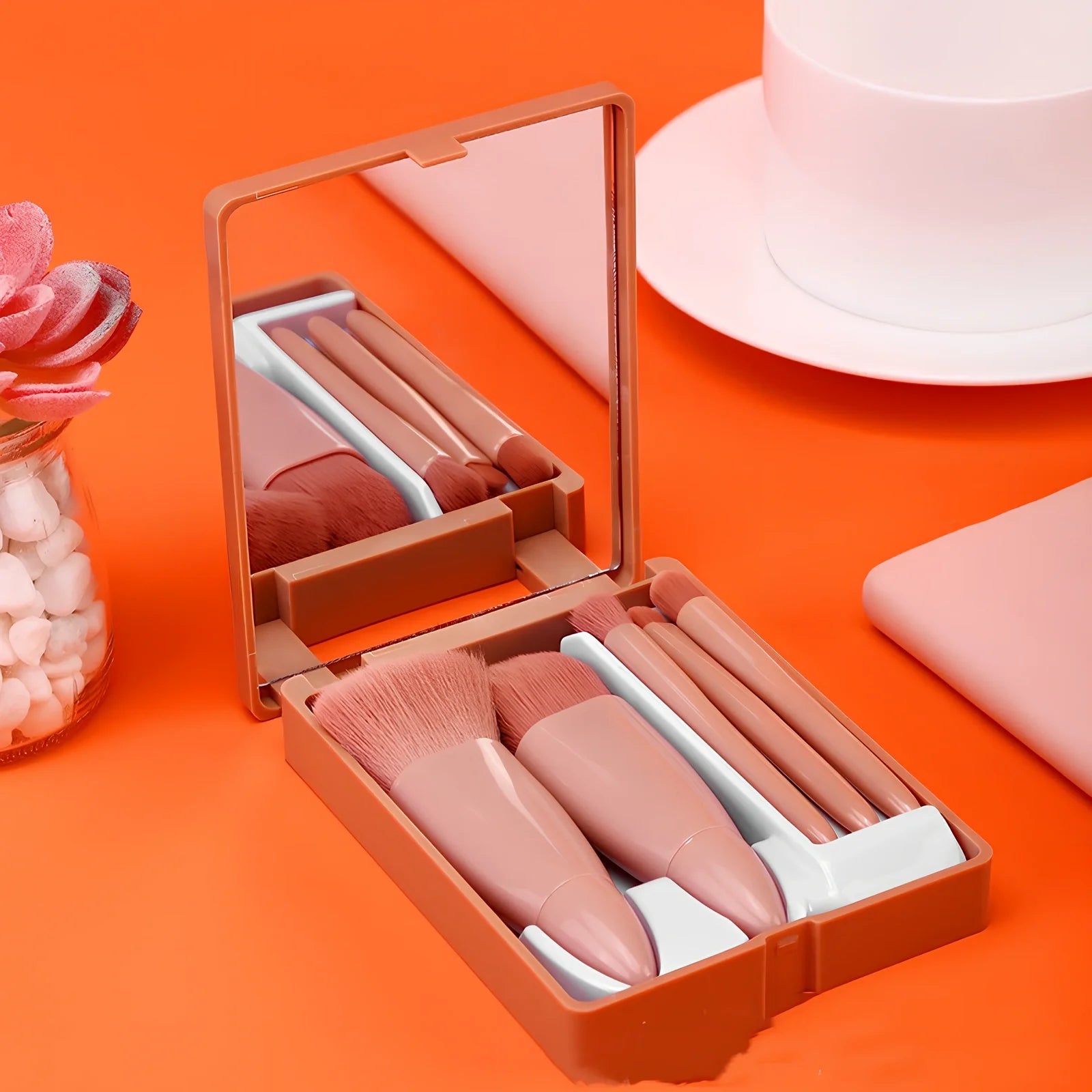 Pink 5-piece makeup brush set with mirror showing powder, foundation, blush, and eye brushes