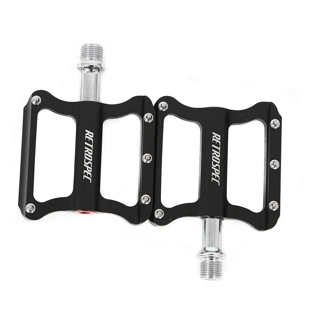 Black CNC aluminium mountain bike pedal with anti-skid nails and sealed bearing, 80x80x18mm
